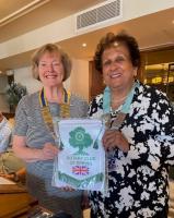 The Rotary Club of Epping's President, Barbara Scruton present the club pennant to District Governor Suraiya Kassamally.